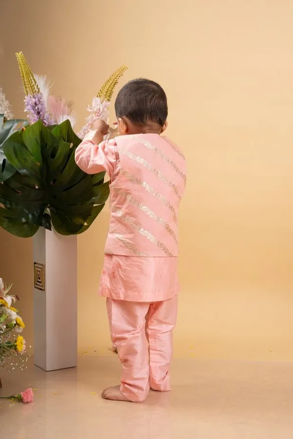 Elegant soft Peach kurta set with a regal golden-detailed jacket for a charming festive look